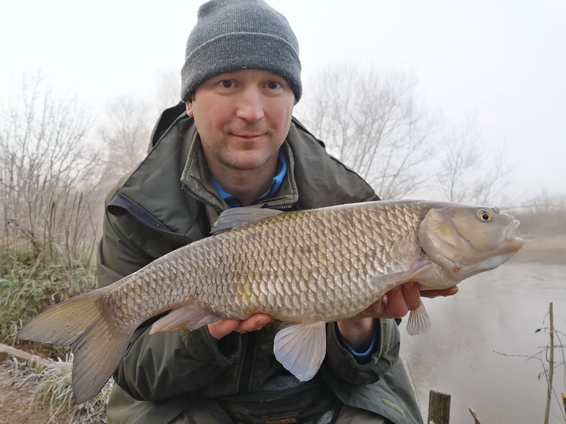 The author holding a large pin caught chub.